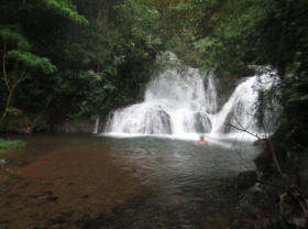 Waterfall in Azuero with man by it – Best Places In The World To Retire – International Living